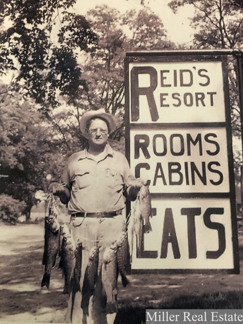Reids Resort Thornapple Lake (Coles Landing) - Man With His Fish Near Sign (newer photo)